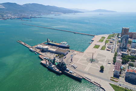 Aerial view of the Novorossiysk port and its entrance, the marine station and the ship-museum cruiserの写真素材