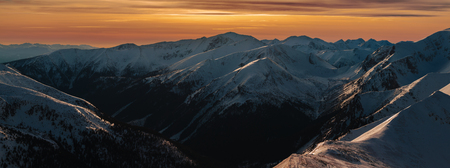 Winter panoramic landscape with sunset over Tatra Mountains, Zakopane, Polandの写真素材