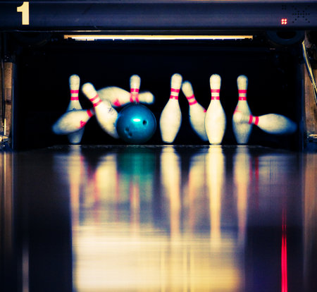 Bowling Blue ball hits the skittles.の写真素材