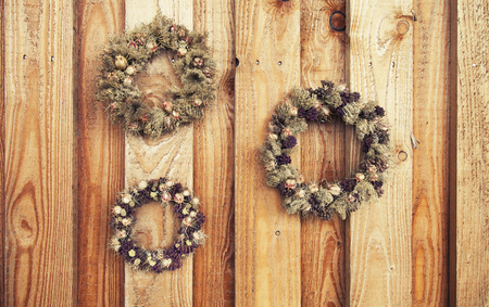 flower wreath on wooden rustic backgroundの写真素材