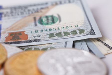 golden bitcoin coin on us dollars. Cryptocurrency business concept background