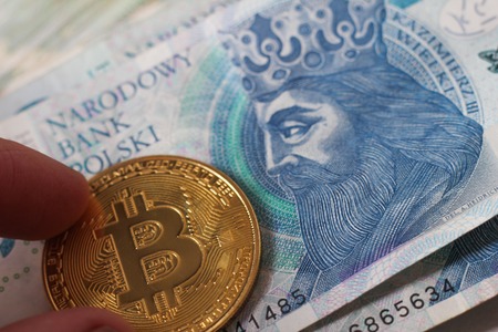 Macro money 100 euro background. golden bitcoin coin on us dollars. Cryptocurrency business concept...