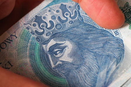 Macro money 100 euro background. golden bitcoin coin on us dollars. Cryptocurrency business concept greenの写真素材