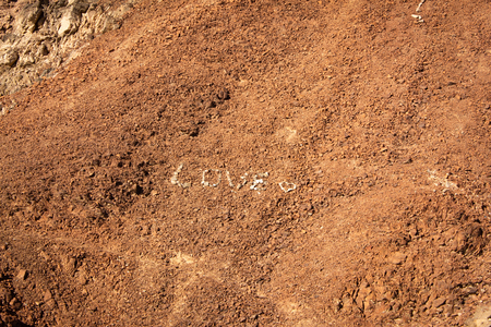 LOVE word making with stones in the desert.の写真素材