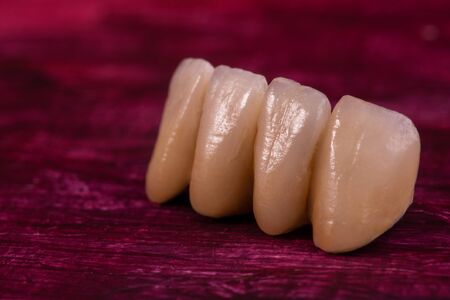 Dental Ceramic Crowns on red background