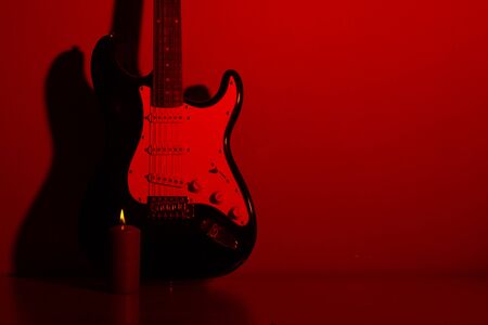 electric guitar in front of a vintage wall with shadowの写真素材