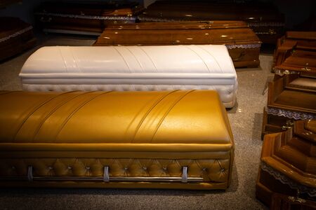 Gold Coffin with new modern like a Sofa chester style. Funeral home.