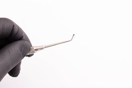 dentist tools on white background with black dentist glow