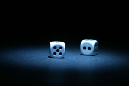 about 5 second time laps aka "bulb" exposure of dice 5 & 2 =7 lit with a small flashlightの写真素材