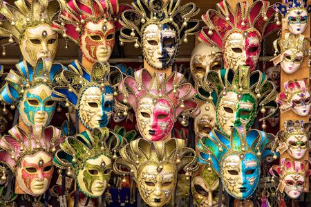Italian carnival masks for sale from a vendor's cart in Florence (Firenze), Italy.の写真素材