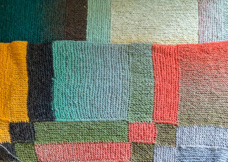 beautiful knitted wool scarf, traditional handicraft type, knitted background and texture, handmade, knitting pattern backgroundの写真素材