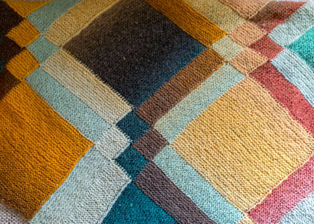 beautiful knitted wool scarf, traditional handicraft type, knitted background and texture, handmade,...