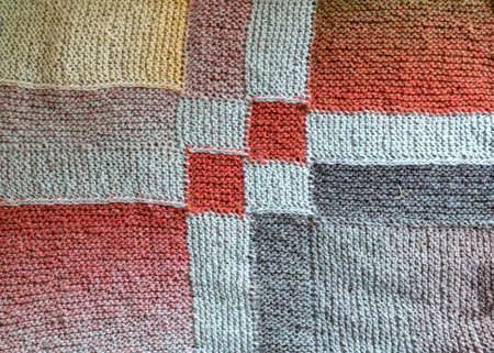 beautiful knitted wool scarf, traditional handicraft type, knitted background and texture, handmade, knitting pattern backgroundの写真素材