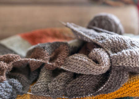 beautiful knitted wool scarf, traditional handicraft type, knitted background and texture, handmade, knitting pattern backgroundの写真素材