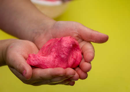 children's hands with self-made slime, slime making at a birthday party, close up of a little child is hand playing a slime,
handmadeの写真素材