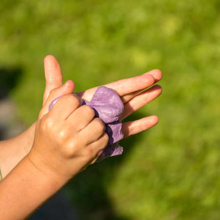 children's hands with self-made slime, slime making at a birthday party, close up of a little child is hand playing a slime,
handmadeの写真素材