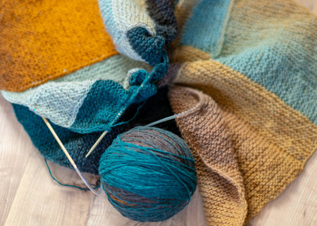 photography with colored knitting, needles and a ball of wool yarn, knitting as a hobby, handmadeの写真素材