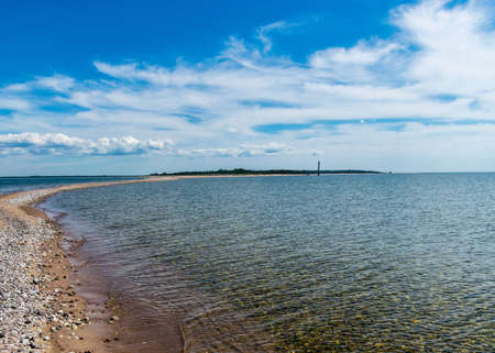 traditional sunny summer landscape with sandy and pebbly promontory, blue sea and sky, Harilaid Nature Reserve, Estonia, Baltic Seaの写真素材