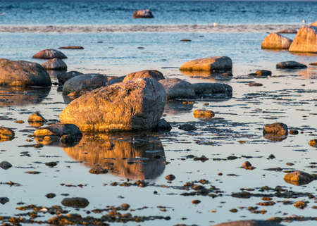 beautiful sunset landscape from a traditional rocky beach on the island of Saaremaa, Cape Undva, Tagamoisa Peninsula, Saaremaa Island, Estoniaの写真素材