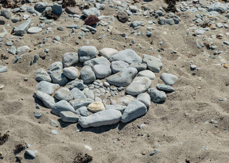 picture with beautiful white stone piles by the sea, these objects were built by travelers, Saaremaa Island, Estoniaの写真素材