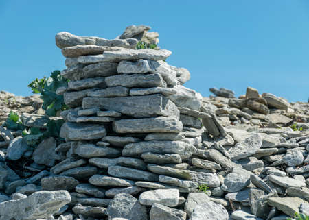 picture with beautiful white stone piles by the sea, these objects were built by travelers, Saaremaa Island, Estoniaの写真素材