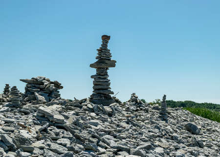 picture with beautiful white stone piles by the sea, these objects were built by travelers, Saaremaa Island, Estoniaの写真素材