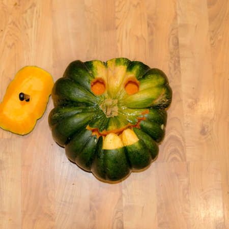Preparing for Halloween, pumpkin carving, green carved pumpkin for Halloween, Halloween Jack o Lanterns, autumnの写真素材
