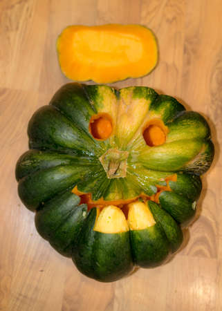 Preparing for Halloween, pumpkin carving, green carved pumpkin for Halloween, Halloween Jack o Lanterns, autumnの写真素材