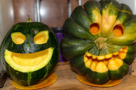 Preparing for Halloween, pumpkin carving, green carved pumpkin for Halloween, Halloween Jack o Lanterns, autumnの写真素材