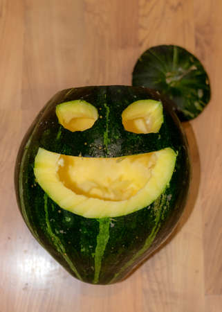 Preparing for Halloween, pumpkin carving, green carved pumpkin for Halloween, Halloween Jack o Lanterns, autumnの写真素材