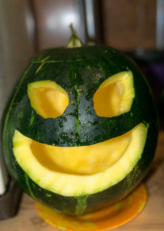 Preparing for Halloween, pumpkin carving, green carved pumpkin for Halloween, Halloween Jack o Lanterns, autumnの写真素材