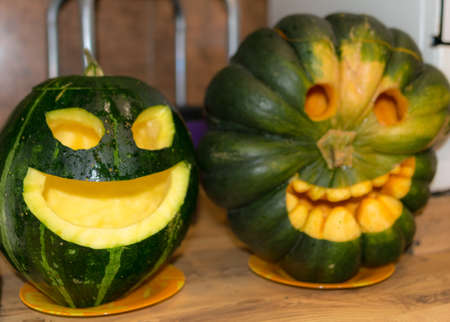 Preparing for Halloween, pumpkin carving, green carved pumpkin for Halloween, Halloween Jack o Lanterns, autumnの写真素材