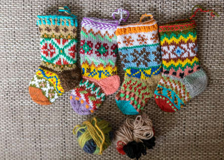 photography with beautiful, variegated small children's socks, handmade, wool yarn, knitted textureの写真素材