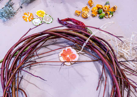 Christmas handmade diy background. Making craft xmas wreath and ornaments. Workplace for preparing handmade new year decorations. Winter holidays concept. Home leisure, tools, trinkets and details for holiday decorations,  Creative christmas diyの写真素材