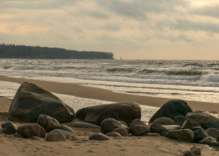 landscape with sea shore, rocks in water and sand, winter, December, Vidzeme rocky seashore, Latviaの写真素材