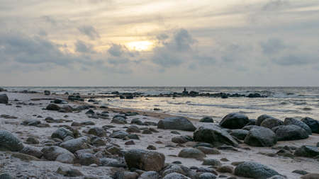 landscape with sea shore, rocks in water and sand, winter, December, Vidzeme rocky seashore, Latviaの写真素材