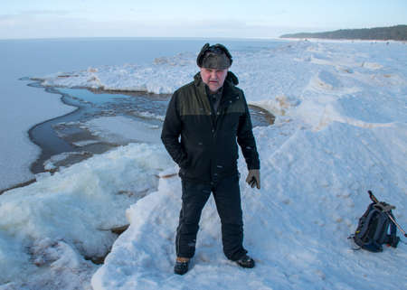 winter landscape by the sea, male silhouette by the sea, blurred snow background, blurred outlines, winterの写真素材