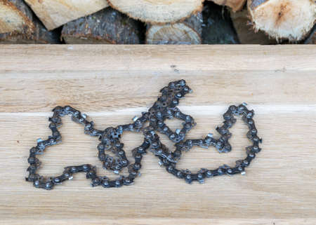 photography with antique chain on wooden background, rusty tools, metal waste, scrap metalの写真素材