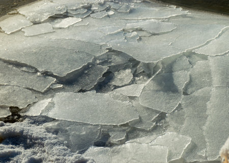 winter landscape by the sea, snowy, interesting ice shapes on the sea shore, dunes covered with a white layer of shining snow, winterの写真素材