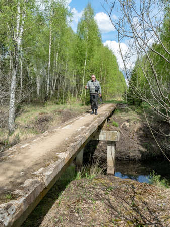 landscape with a bridge over a bog ditch,の写真素材