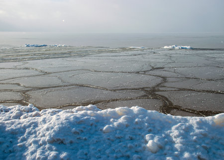 various ice formations in the sea, ice texture on the water surface, beautiful winter day by the sea, winterの写真素材