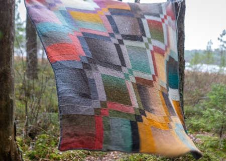 beautiful colored wool knitted blanket, knitting as a hobby, a good way to spend free time is...