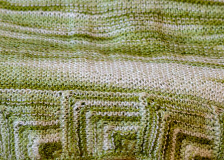 beautiful knitted wool scarf, traditional handicraft type, knitted background and texture, handmade,...