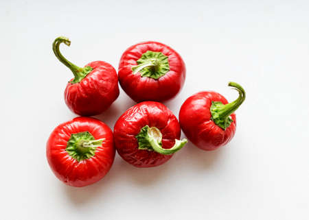 beautiful red mini peppers on a light background, suitable for wallpaperの写真素材