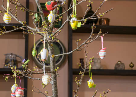decorated oak branch with colored eggs, European Easter with traditional decoration eggs, Easter...