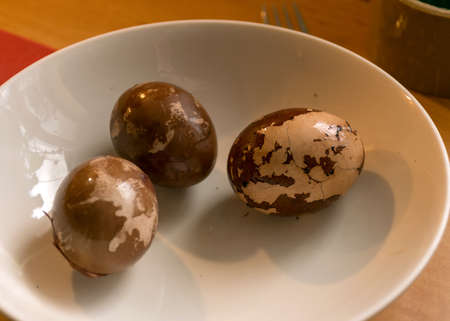 decorated Easter eggs on a plate, European Easter with traditional decoration eggs, easter eggs...
