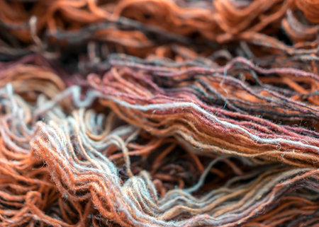 photography with colorful, variegated, bright wool yarn fragments, knitting and handicraft concept