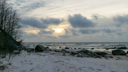 landscape with sea shore, rocks in water and sand, winter, December, Vidzeme rocky seashore, Latviaの写真素材