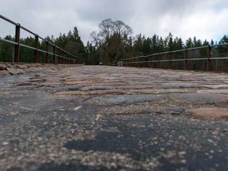 bridge cover, old stone pavement, close-up view, blurred background