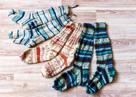 multicolor hand knitted different sizes and different colors warm winter wool knitted socks, waiting for winter, handmadeの写真素材